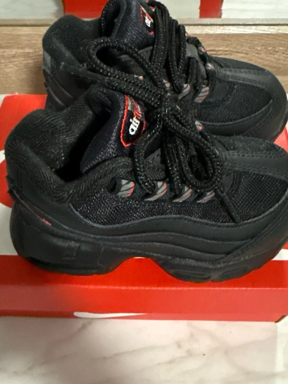Nike Kids Black Sneakers with Red Accents